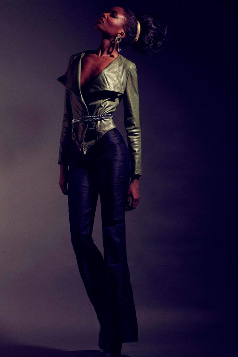 A cropped jacket worn over tailored trousers