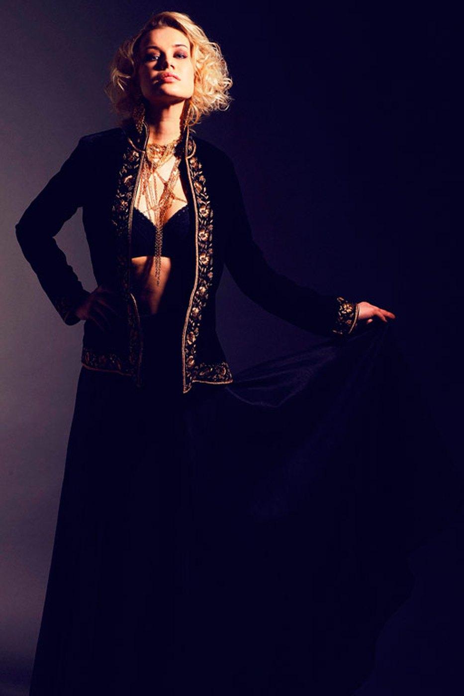 A sharply tailored black evening coat
