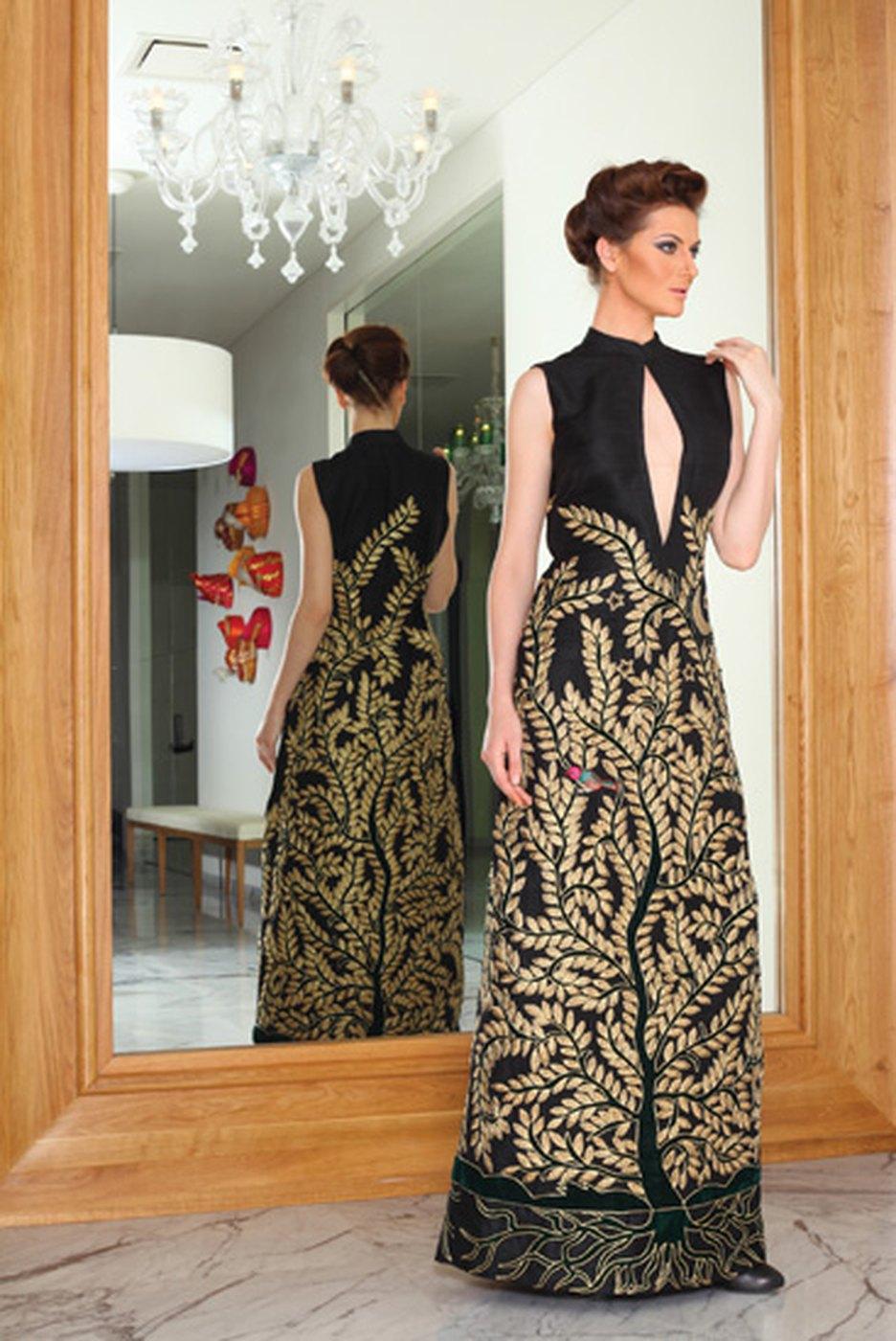 A gold brocade gown photographed in a Dubai interior